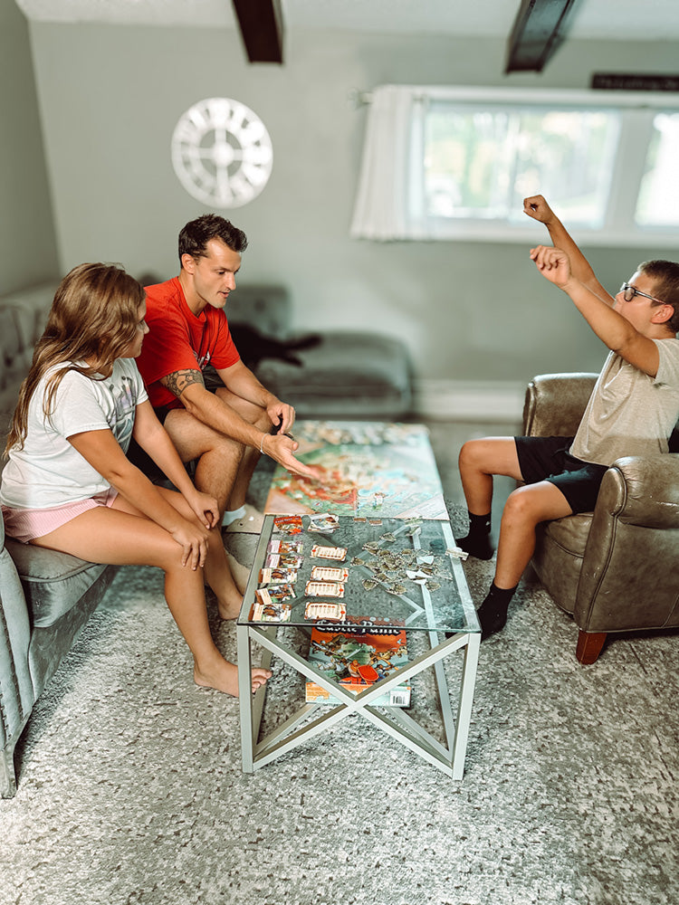A father, daughter, and son excited play Castle Panic
